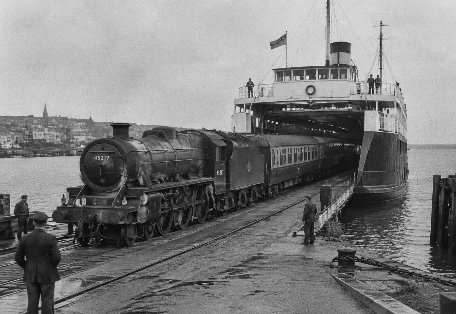 Railway carriages being driven aboard a train ferry
